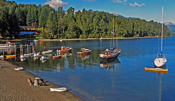 istock lake beach and sailboats 599466264
