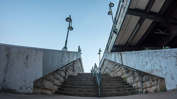 istock Looking up to stairs from under a bridge 599466950