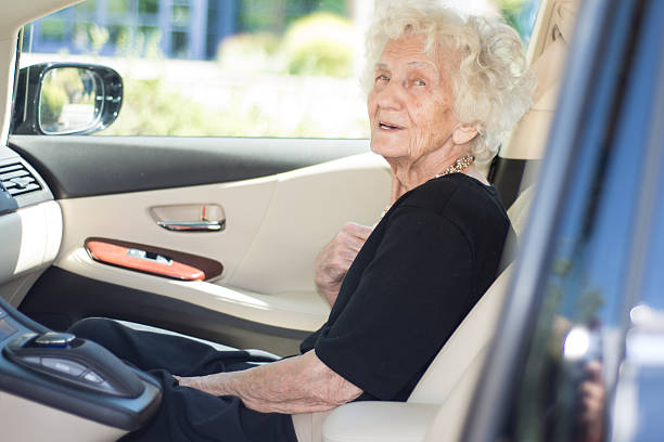 istock Senior Woman Fastening Seat Belt for Safety 599467992