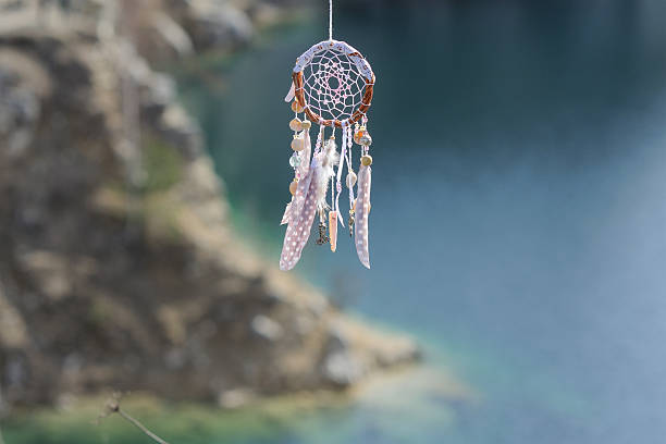 istock Handmade native american dream catcher on background of rocks an 599468708
