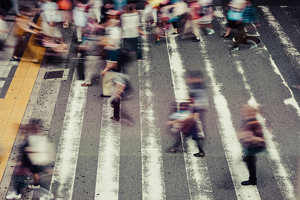 istock Asian People are across the crosswalk 599469930