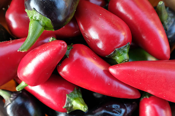 istock Red and black jalapeo peppers in basket. 599470612