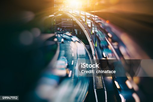 istock blurred traffic  in central district 599471112