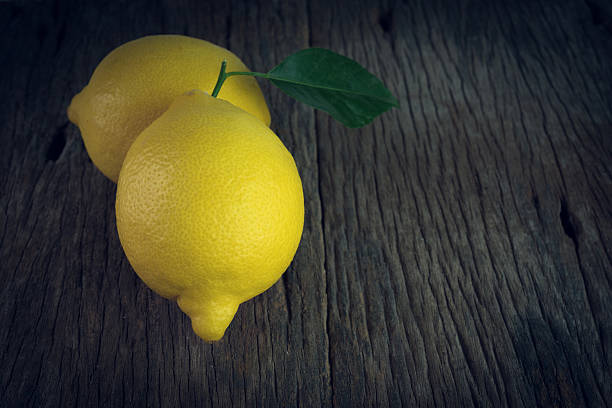 istock Fresh lemons on wooden 599472026