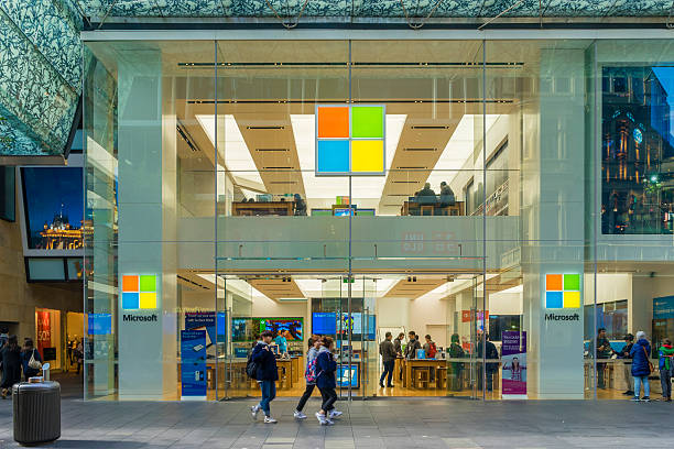 Pedestrians passing by Microsoft flagship store in Sydney Sydney, Australia - June 26, 2016: View of pedestrians passing by Microsoft flagship store in Sydney during daytime. microsoft stock pictures, royalty-free photos & images