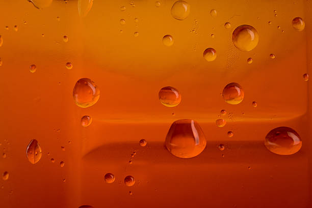 istock drops of water brown color for background 599473792