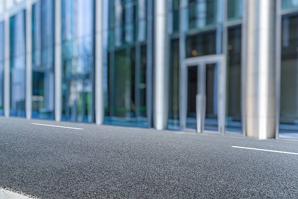 istock clean asphalt road front of office building 599474778