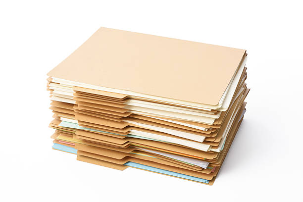 istock Isolated shot of stacked brown file folder on white background 599474990
