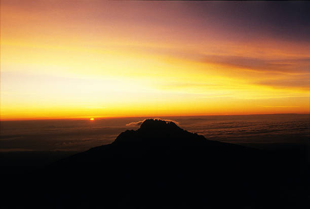 Mawenzi peak viewed from Mt. Kilimanjaro, Mt Kilimanjaro Park, Tanzania Mawenzi peak viewed early in the morning from Mt. Kilimanjaro slopes, Mt Kilimanjaro Park, Tanzania mawenzi stock pictures, royalty-free photos & images