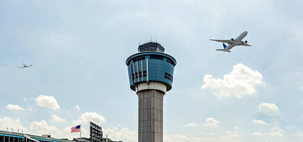 Laguardia Airport Tower New York Stock photo of airplanes taking off and landing at Laguardia airport in New York landing touching down stock pictures, royalty-free photos & images