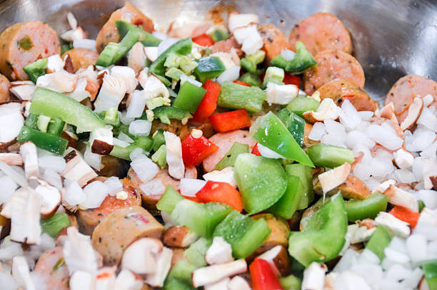istock Sausage and vegetable meal being cooked in a pan 599479806