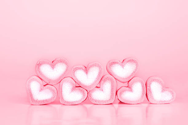 istock the marshmallow heart shape on pink background with love concept 599481886
