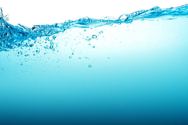 istock Close up blue Water splash with bubbles on white background 599482436