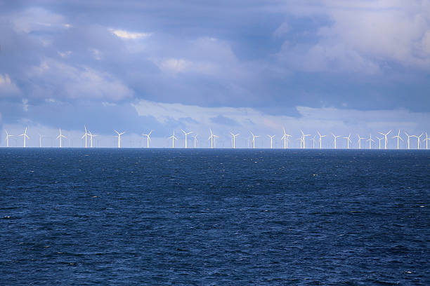 istock Windmills in a row in the Baltic sea 599484394