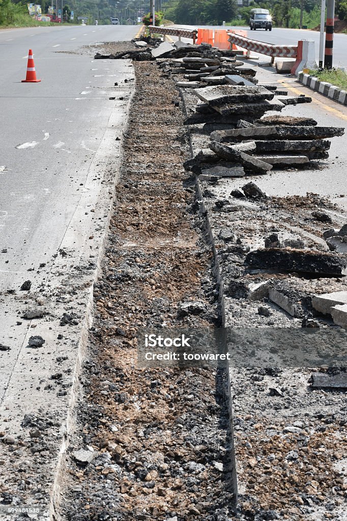 Repairing the asphalt pavement on the road. Asphalt Stock Photo