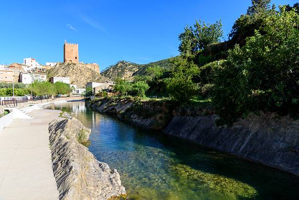 istock Spanish village beside a river 599485940