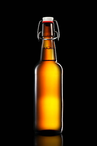 istock Swing top bottle of light beer isolated on black background 599487534