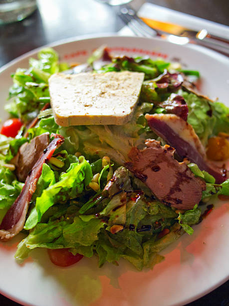 istock Green salad with duck magret 599488538