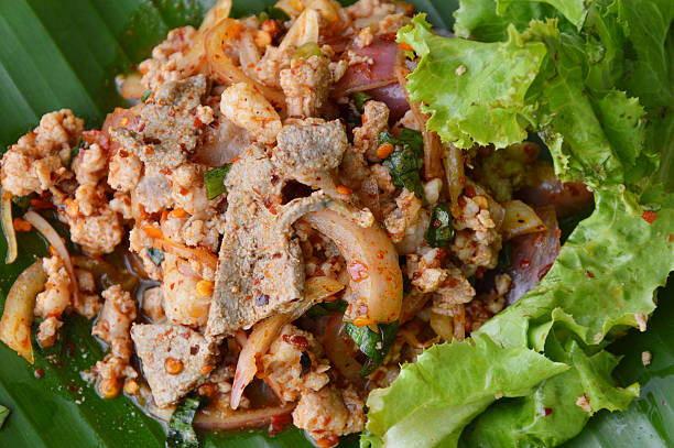 istock spicy minced pork salad on fresh banana leaf 599488760