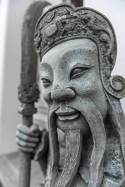 Chinese guardian figure at Wat Pho Buddhist temple in Bangkok, Thailand