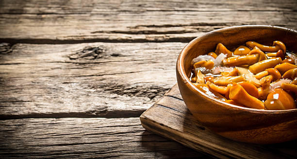 istock Marinated mushrooms in a bowl on the Board. 599489908