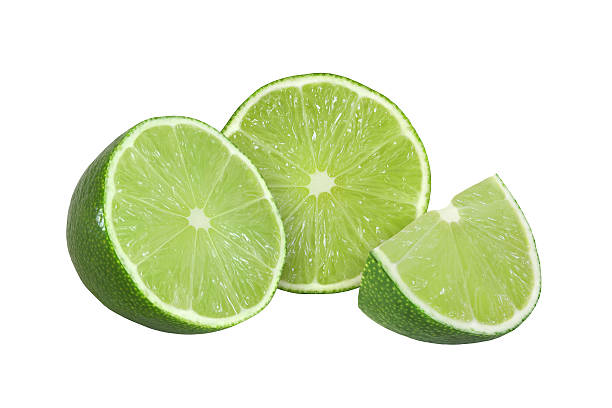 istock cut lime fruits isolated on white background with clipping path 599494090