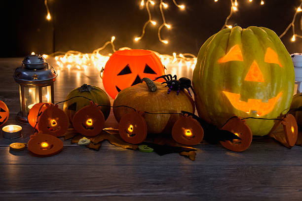istock Halloween pumpkin head jack lantern on wooden background 599496440
