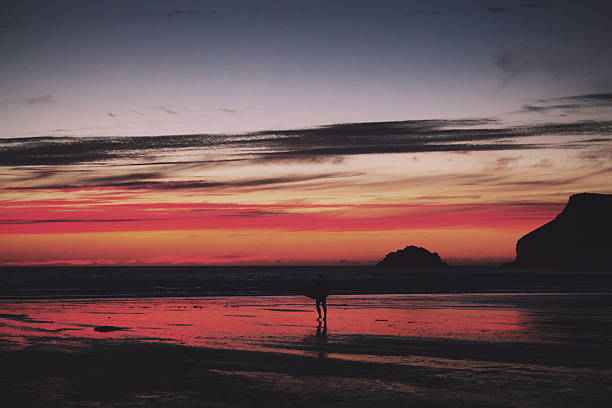 istock Colourful sunset over the beach at Polzeath Vintage Retro Filter 599496684