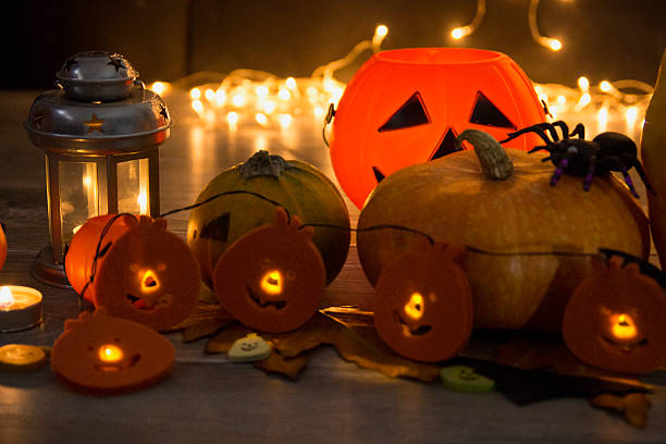 istock Halloween pumpkin head jack lantern on wooden background 599497030