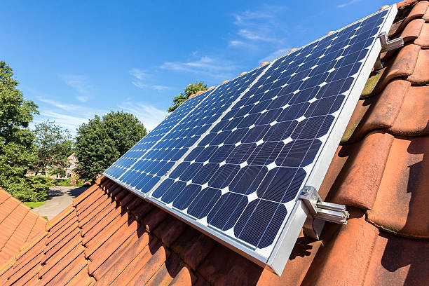 istock Row of solar panels  on roof 599497714