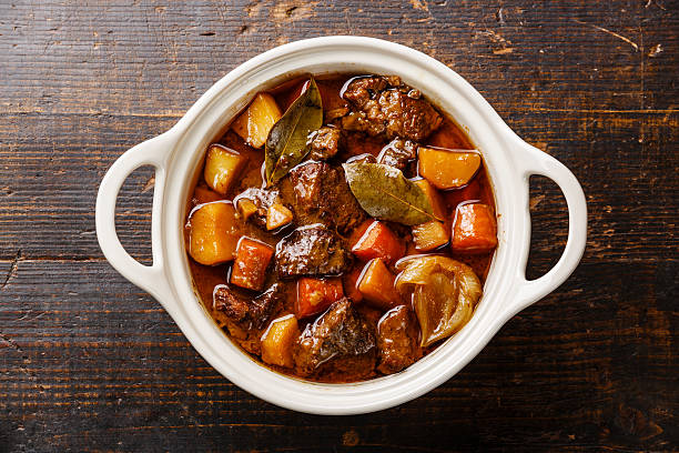 beef meat stewed with potatoes - food high angle view table stew imagens e fotografias de stock
