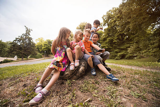 istock Group of small kids taking a selfie with cell phone. 599499896