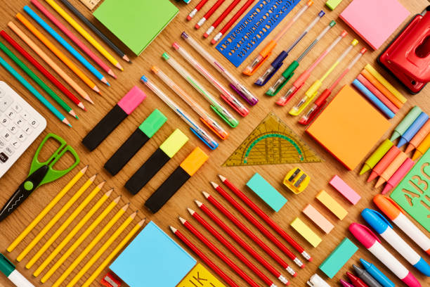 Office and school supplies arranged on wooden table - Knolling Directly above shot of office and school supplies. Full frame shot of stationery arranged on wooden surface. Knolling Concept. picture of protractor stock pictures, royalty-free photos & images