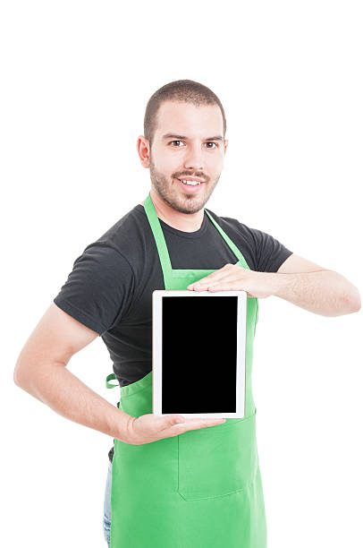 istock Joyful hypermarket male employee presenting tablet 599502610