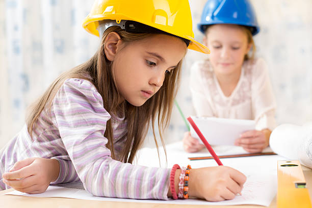 istock Team of little engineers 599505390