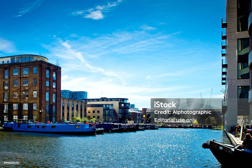 Narrowboating Kings Cross. London, Uk - May 1, 2016: Narrowboating at Kings Cross near Camden Lock. There  is a narrowboat on the Regents canal in this up and coming development area of London. Activity Stock Photo