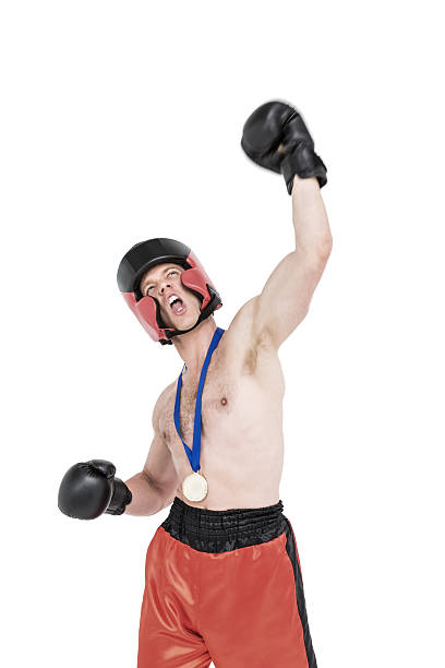 istock Boxer wearing gold medal performing boxing stance 599673358