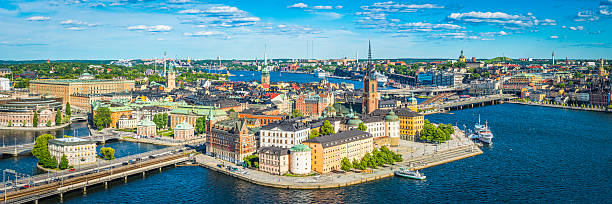 Stockholm aerial panorama over historic Gamla Stan Sodermalm landmarks Sweden Panoramic aerial view over the blue summer skies above the iconic waterfront of Gamla Stan and Sodermalm in the heart of Stockholm, Sweden's vibrant capital city. sodermalm photos stock pictures, royalty-free photos & images