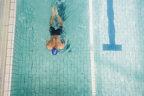 istock Swimmer doing the breaststroke in swimming pool 599673908