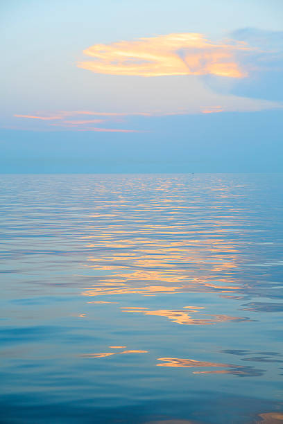 istock Relaxing sunset   The sky with clouds reflected in the sea 599673974