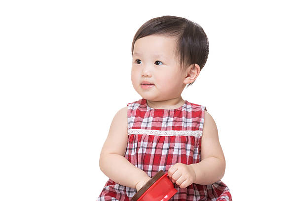 istock Chinese baby girl playing with cup 599674930