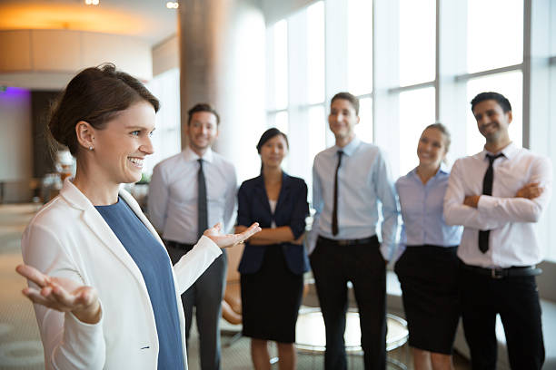 istock Smiling Businesswoman with Team 599676226