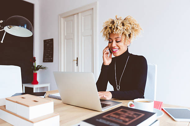 istock Afro american young woman in a home office 599676254