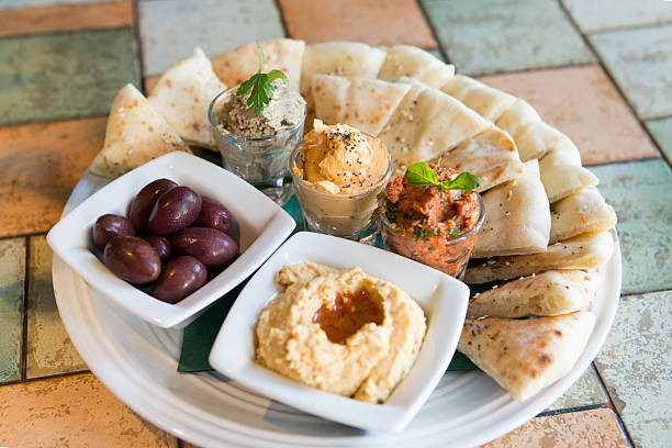 istock Pita bread slices served with hummus and pates 599676952