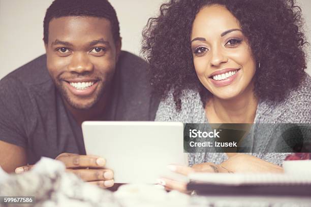 Afro American Happy Couple Using A Digital Tablet Stock Photo - Download Image Now - Adult, Adults Only, African Ethnicity