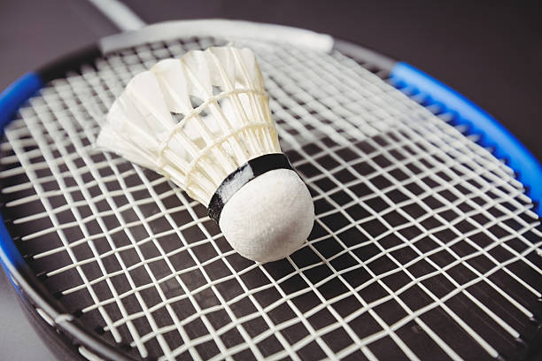 istock Close up of shuttlecock and badminton racket 599677594