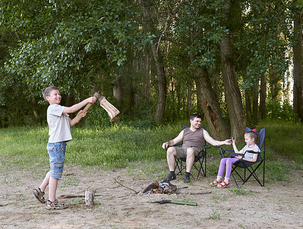 istock people camping in forest, family active in nature, kindle fire 599678352