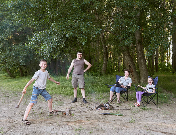 people camping in forest, family active in nature, kindle fire