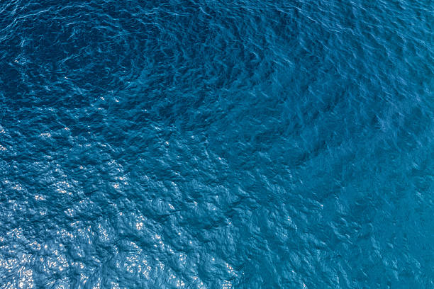 Sea floor Aerial shot of clear sea water surface with sea floor sea stock pictures, royalty-free photos & images