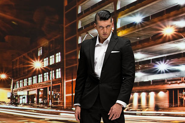 istock Smart casual man standing at night outdoors 599679418